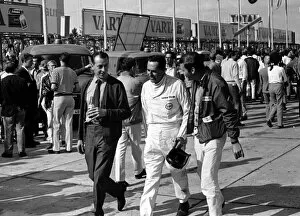 Images Dated 19th May 2014: 1967 GERMAN GP -NURBURGRING: Jack Brabham wanders through the paddockbefore the race
