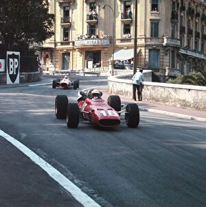 Trending: 1967 Monaco Grand Prix: Lorenzo Bandini leads John Surtees. Bandini later crashed suffering fatal