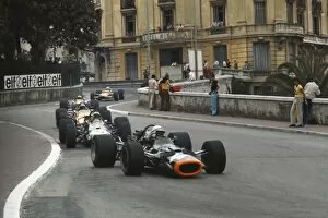 Images Dated 7th November 2013: 1969 Monaco Grand Prix: John Surtees, BRM P138, leads Jack Brabham, Brabham BT26A Ford
