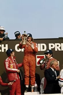 1975 Dutch Grand Prix - Podium: James Hunt, 1st position, with Niki Lauda, 2nd position and Clay Regazzoni