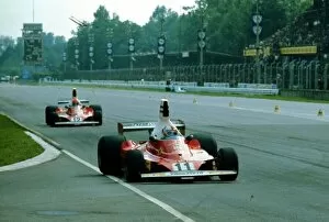 Images Dated 30th April 2021: 1975 ITALIAN GP. Ferrari Team mates Clay Reggazoni (Race winner) and Niki Lauda (3rd