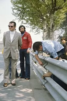 Images Dated 1st May 2012: 1975 Spanish Grand Prix - Ken Tyrrell: Ken Tyrrell examines the armco barriers