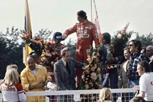 1976 Belgian Grand Prix - Podium: Niki Lauda, 1st position, celebrates with Clay Regazzoni