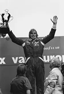 1976 F1 Season Collection: 1976 Dutch Grand Prix: James Hunt, 1st position, celebrates on the podium with Clay Regazzoni