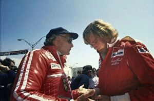 1976 F1 Season Collection: 1976 United States Grand Prix West: Niki Lauda and James Hunt talk in the pits before the race