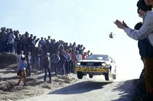 Images Dated 13th October 2004: 1984 FIA World Rally championship: Spectators watch on as a Audi Quattro gets airborne