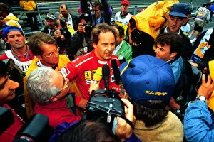 Images Dated 21st April 2021: 1995 BELGIAN GP. Gerhard Berger, Ferrari talks to the media after securing pole