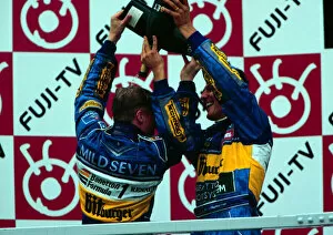 Images Dated 21st April 2021: 1995 JAPANESE GP. Michael Schumacher and Johnny Herbert celebrate in Suzuka after