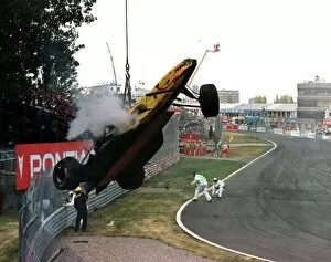 1997 CANADIAN GP. Ralf Schumacher's wrecked car is lifted away after a massive crash