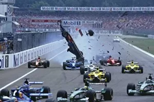 Images Dated 9th October 2013: 2001 German Grand Prix: Luciano Burti flies through the air after he launched off of the back of