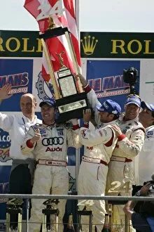 Images Dated 19th June 2005: 2005 Le Mans 24 Hours - Podium: JJ Lehto / Marco Werner / Tom Kristensen the trophy