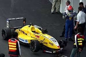 Images Dated 16th November 2003: 50th Macau Grand Prix: Nelson Piquet Jnr Hitech Racing inspects the damage to his front wing
