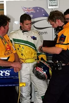 Images Dated 22nd October 2005: A1 Grand Prix: Will Davison A1 Team Australia talks with engineers