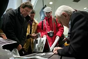 Images Dated 22nd November 2004: Aintree Festival of Motorsport: Roy Salvadori signs autographs for the fans