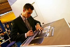 Images Dated 9th January 2004: Autosport International Show: Alan Van Der Merwe British Formula Three Champion signs his picture