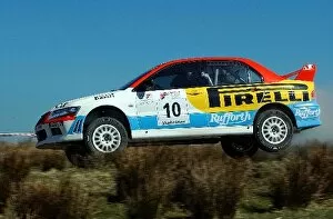 Images Dated 8th April 2002: British Rally Championship: Alistair Ginley Mitsubishi Evo 7 gets airborne