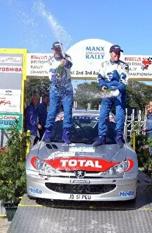 Images Dated 4th August 2002: British Rally Championship: Justin Dale and Andrew Bargery spray the champagne