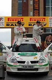 Images Dated 28th April 2003: British Rally Championship: Mark Higgins celebrates on his car with the champagne