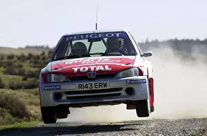 Images Dated 8th April 2002: British Rally Championship: Martin Sansom Peugeot 106 Maxi Kit Car gets airborne