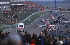 Images Dated 9th October 2013: BTCC Brands - Safety Car: The safety car and an ambulance chase after the pack