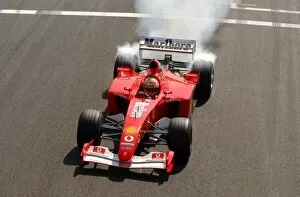 Images Dated 10th August 2003: Burn out of Luca Badoer (ITA), Scuderia Ferrari Marlboro FW2002-GA, Testdriver