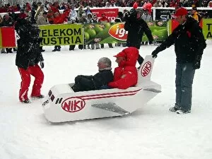 Images Dated 1st February 2005: Charity Ski Event: Bernie Ecclestone F1 Supremo takes a ride in a sleigh with Niki Lauda