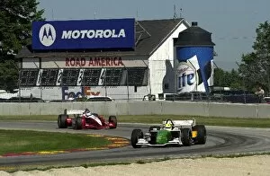 Images Dated 16th August 2002: Christian Fittipaldi leads Scott Dixon through turn 14 at the Motorola 220 at Road America
