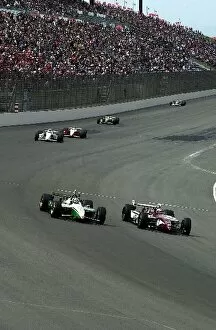 Images Dated 27th April 2002: Dario Franchitti (GBR), Honda / Reynard and Tony Kanaan go head to head into turn one during