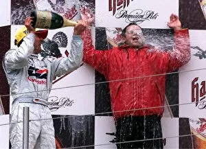 Images Dated 8th May 2001: Deutche Tourenwagen Masters: Bernd Schneider sprays champaigne over Audi team boss H.J. Abt