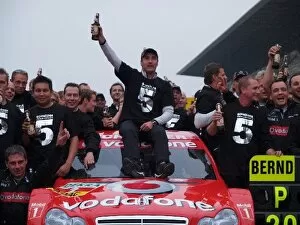 Images Dated 15th October 2006: DTM: Bernd Schneider and the Vodafone AMG-Mercedes team celebrate winning the 2006 DTM