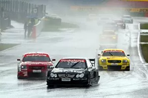 DTM: Jean Alesi AMG Mercedes CLK DTM leads the field in the very wet conditions