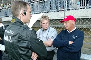 Images Dated 7th September 2003: DTM: Niki Lauda, talking with some Mercedes-Benz mechanics. DTM Championship, Rd 8, A1-Ring, Austria