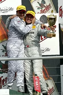 Images Dated 5th October 2003: DTM: Race winner Jean Alesi, AMG Mercedes-Benz, left, and third placed Marcel Fassler