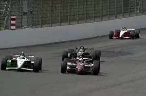 Images Dated 27th April 2002: Early leaders Tony Kanaan and Paul Tracy goe wheel to wheel in front of Cristiano da Matta