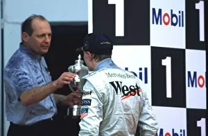 Images Dated 21st April 2021: EUROPEAN GRAND PRIX 1997 MIKA HAKKINEN AND RON DENNIS CELEBRATE MIKAs FIRST WIN