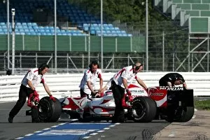 Images Dated 21st September 2006: F1 Testing: Takuma Sato Super Aguri SA06 is pushed back into the garage