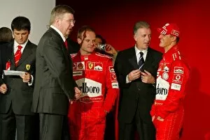 Images Dated 26th January 2004: Ferrari Launch: Michael Schumacher Ferrari F2004 talks with Piero Lardi Ferrari Vice-President of