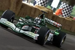 Images Dated 8th July 2001: Festival Of Speed: Eddie Irvine demonstrates the Jaguar with style