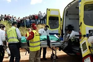 Images Dated 23rd March 2011: FIA World Rally Championship: Alex Gelsomino is taken to the ambulance on the shakedown stage
