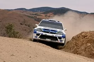 FIA World Rally Championship: Daniel Sola, Ford Focus RS WRC, clips a rock on stage 2
