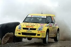 Images Dated 18th September 2005: FIA World Rally Championship: Guy Wilks, Suzuki Swift Super 1600 JWRC, jumps on Stage 9