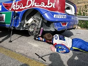 Jordan Collection: FIA World Rally Championship: Jari-Matti Latvala attempts to repair the damage to his suspension