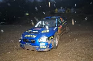 Images Dated 30th November 2007: FIA World Rally Championship: Mads Ostberg, Subaru Impreza WRC, in the rain on Stage 4