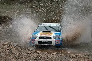 Race Formulae Gallery: FIA World Rally Championship: Marcos Ligato, Subaru Impreza, at the watersplash on Stage 13