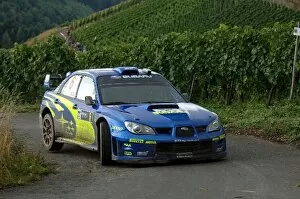 Images Dated 11th August 2006: FIA World Rally Championship: Stephane Sarrazin, Subaru Impreza, on Stage 2 in the Mosel vineyards