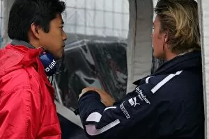 Images Dated 25th April 2006: Formula 1 Testing: Nico Rosberg Williams talks to a Bridgestone engineer