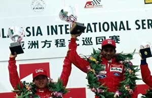 Images Dated 19th November 2001: Formula Asia International Series: The podium: Roy Haryanto second with winner Narain Karthikeyan