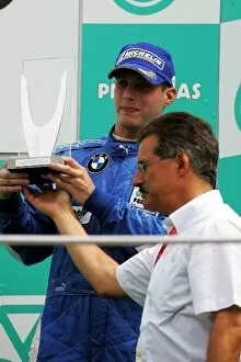 Images Dated 23rd March 2008: Formula BMW Pacific: Third placed Sean McDonagh E-Rain celebrates on the podium with Dr Mario