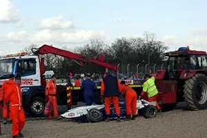 Images Dated 10th April 2005: Formula BMW UK Championship: The car of Joe Osborne is cleared away by marshals after a crash