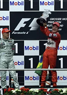 Images Dated 30th July 2000: Formula One German Grand Prix Rubens Barrichello celebrates with Mika Hakkinen Hockenheim
